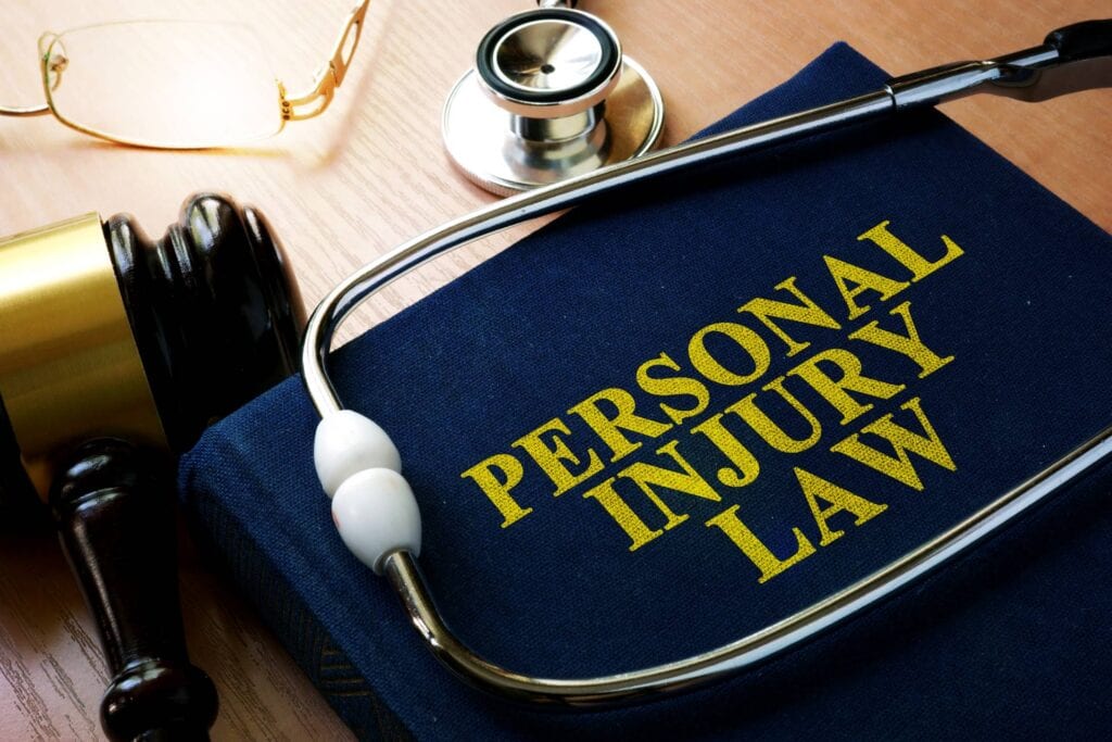 A Legal Nurse Consultant uses a stethoscope and a book with the word personal injury law for their work.