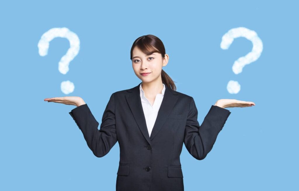 A legal nurse consultant with question marks on her hands.