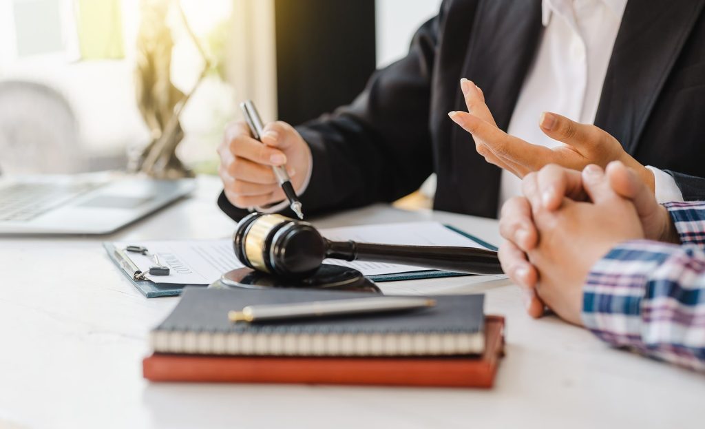 A legal consultant sitting at a desk.