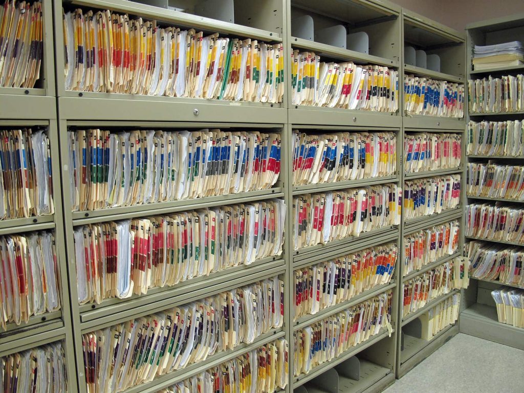 A stack of legal files in a room.